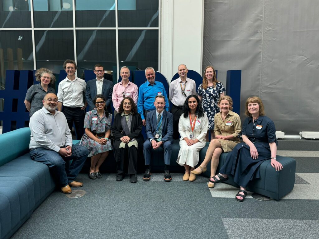 This image shows some of Birmingham City Council's corporate leadership team sitting with Birmingham City University's Pro Vice Chancellor and Professor.